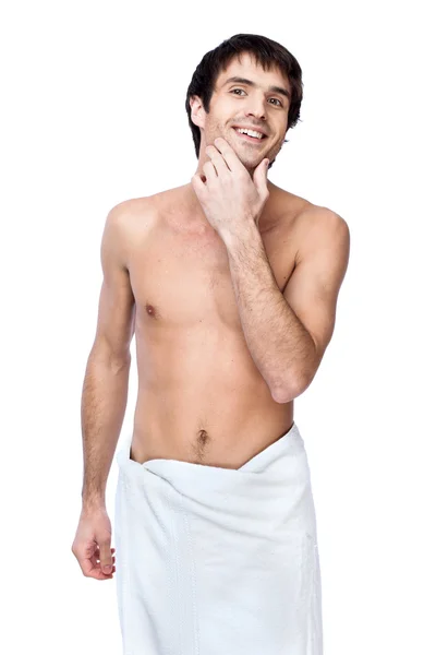 Happy young man with the towel around his waist — Stock Photo, Image