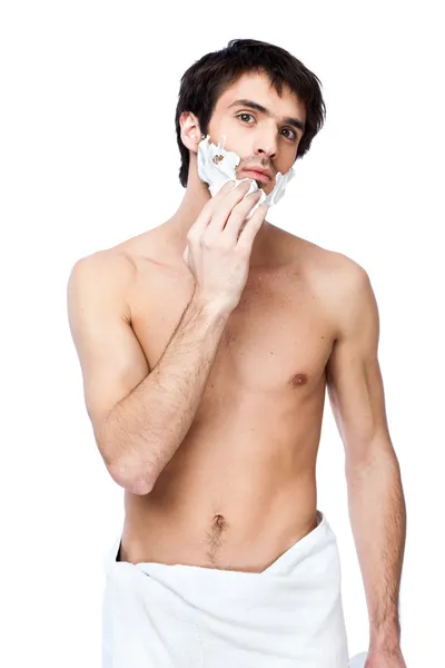 Счастливый молодой человек с полотенцем на поясе — стоковое фото
