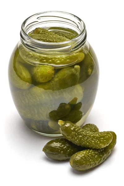 Tasty canned Whole green cornichon in a can isolated on a white background — ストック写真