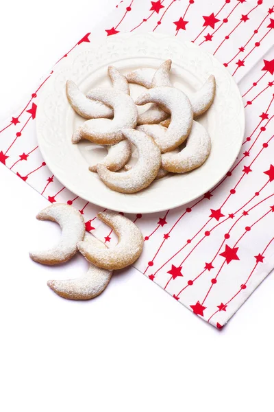 Traditional German or Austrian Vanillekipferl vanilla kipferl cookies on a plate isolated on white background — Stock Photo, Image