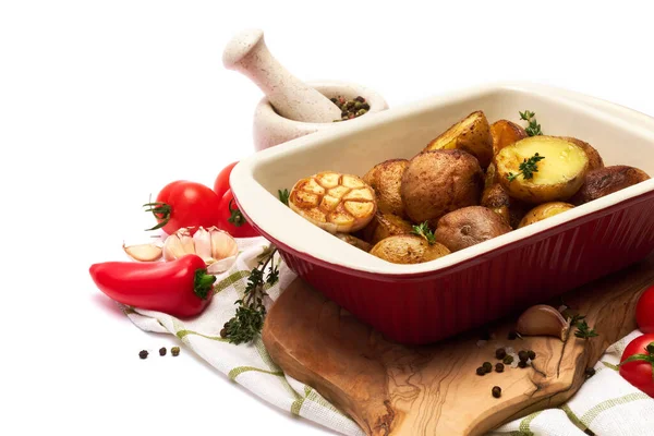 Baked potato in baking dish pot isolated on white background — Stock Photo, Image