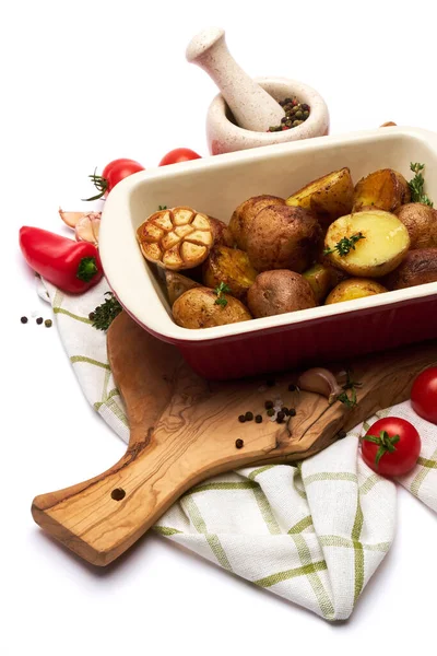 Baked potato in baking dish pot isolated on white background — Stock Photo, Image