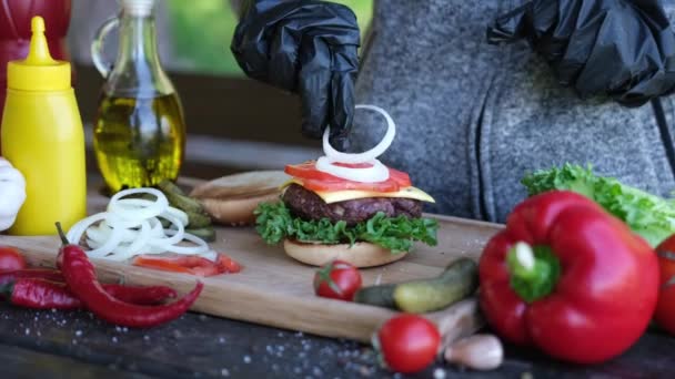 Making Burger Putting Slices Tomato Cucumber Cheddar Cheese — Stock Video