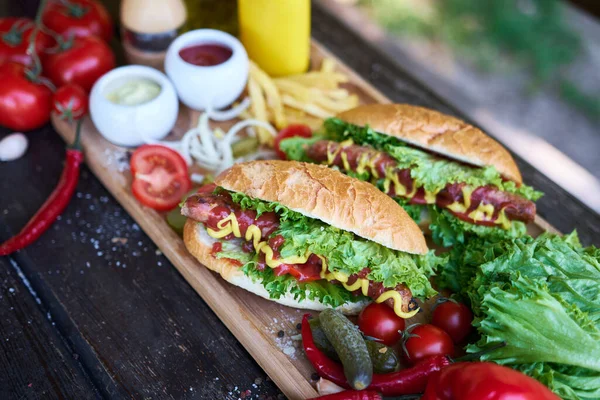 Bbq Hot Dog Served Vegetables French Fries Sauces Wooden Serving — Stock Photo, Image