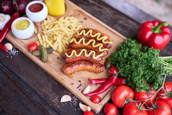 Tasty Freshly Grilled Sausages Served French Fries Sauce Wooden Board — Stock Photo, Image