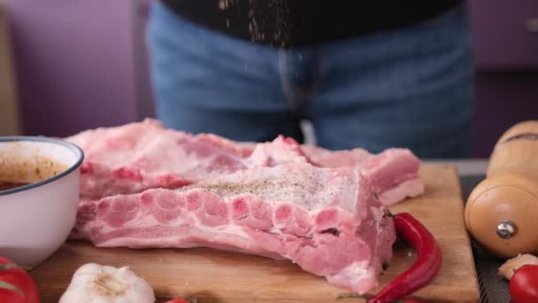 Woman Adding Spices Big Piece Fresh Raw Pink Pork Ribs — Stock Video