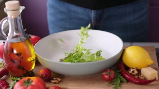 Arugula Salad Leaves Falling Ceramic Bowl — Stock videók