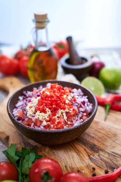 Making Salsa Dip Sauce Chopped Garlic Tomatoes Onion Wooden Bowl — Zdjęcie stockowe