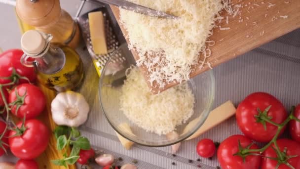 Making Pasta Carbonara Pouring Grated Parmesan Cheese Glass Bowl — Stock Video