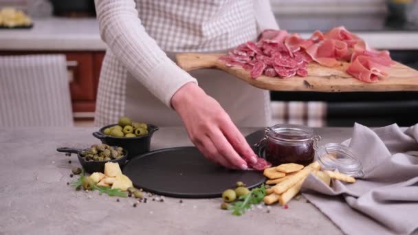Woman Puts Slices Fuet Sausage Stone Serving Board Domestic Kitchen — Vídeos de Stock
