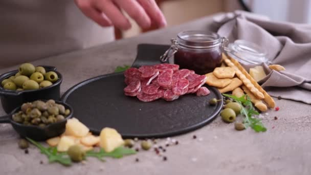 Woman Puts Slices Fuet Sausage Stone Serving Board Domestic Kitchen — Stockvideo