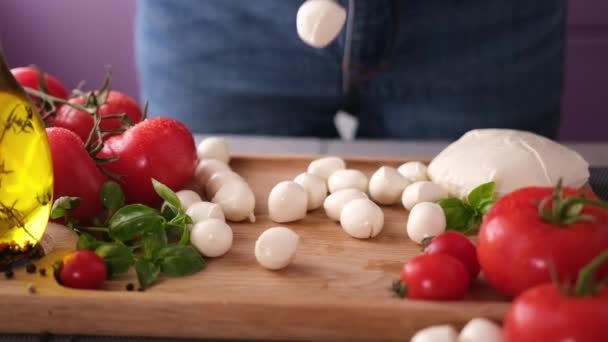 Mozzarella Cheese Small Balls Falling Wooden Cutting Board — Vídeos de Stock