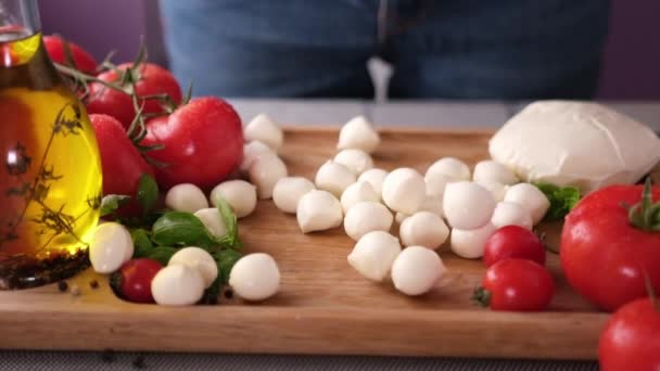 Mozzarella Cheese Small Balls Falling Wooden Cutting Board — Vídeo de stock