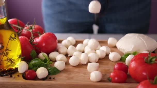 Mozzarella Cheese Small Balls Falling Wooden Cutting Board — Vídeo de stock