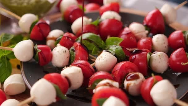 Pouring Balsamic Sauce Caprese Canapes Cherry Tomatoes Mozzarella Cheese Balls — Vídeos de Stock