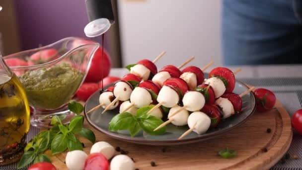 Pouring Balsamic Sauce Caprese Canapes Cherry Tomatoes Mozzarella Cheese Balls — Video