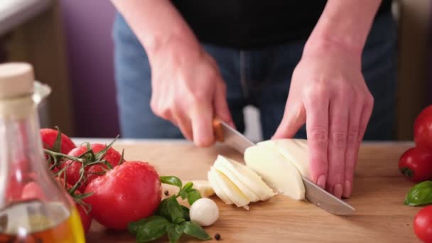 Making Caprese Salad Slicing Cherry Tomatoes Wooden Cutting Board — стоковое видео