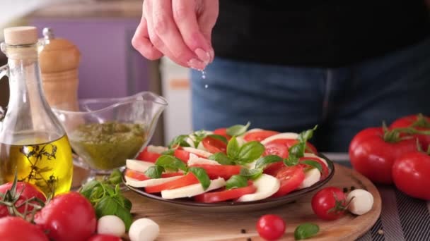 Salting Caprese Salad Mozzarella Cheese Balls Sliced Cherry Tomatoes Basil — Video