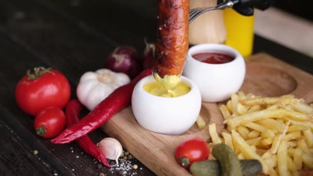 Dipping Tasty Grilled Sausage Mustard Sauce — Vídeo de Stock