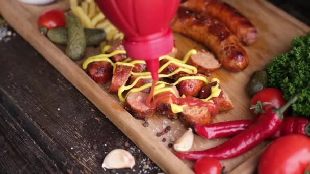 Pouring Tomato Sauce Tasty Grilled Sausages Wooden Serving Board French — Vídeos de Stock