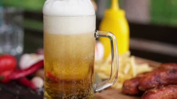 Pouring Beer Glass Mug Tasty Grilled Sausages Background — Vídeos de Stock
