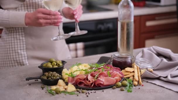Woman Putting Two Glasses Wine Table Meat Cheese Plater Domestic — Stok video