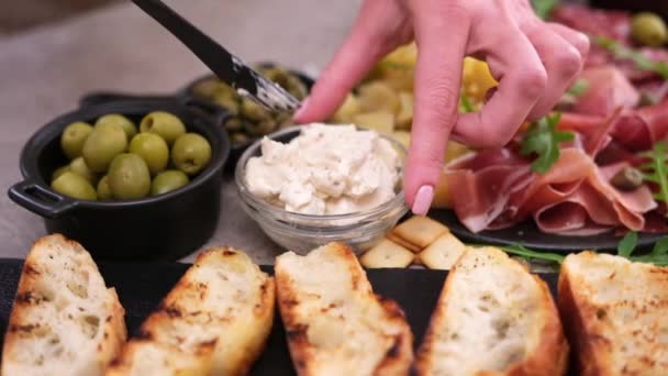 Making Bruschetta Woman Smearing Cream Cheese Grilled Baguette — Stockvideo