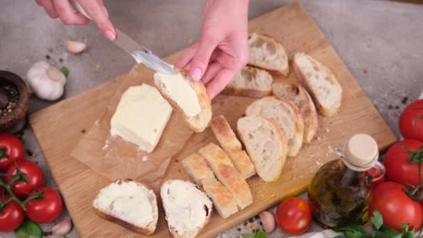 Woman Smearing Soft Butter Slice Baguette Bread Knife Domestic Kitchen — Stockvideo