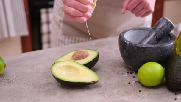 Guacamole Ingredients Avocados Whole Cut Concrete Table Marble Mortar — Stockvideo