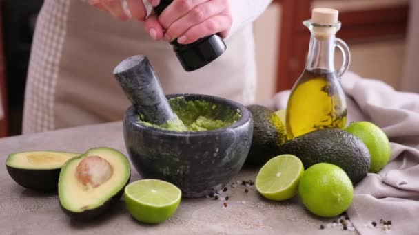 Making Guacamole Sauce Woman Adding Pepper Spices Mashed Avocado Marble — ストック動画