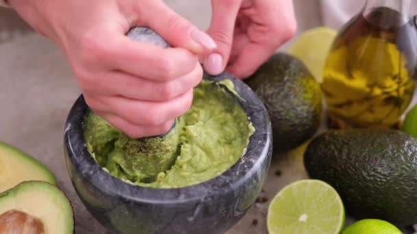 Making Guacamole Sauce Woman Mashing Avocado Marble Mortar Pestle Domestic — 图库视频影像