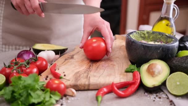 Making Guacamole Sauce Woman Slicing Tomato Wooden Cutting Board — Stockvideo