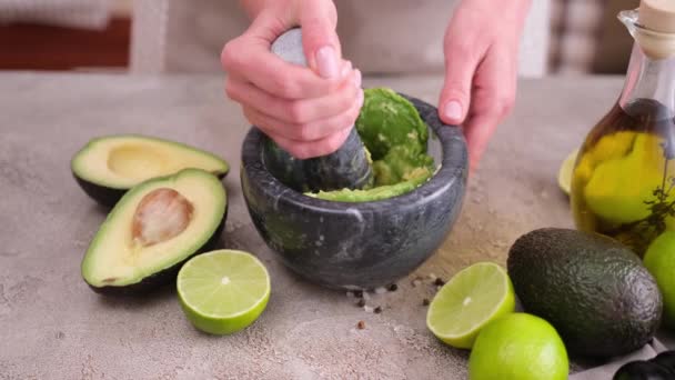 Making Guacamole Sauce Woman Mashing Avocado Marble Mortar Pestle Domestic — Vídeo de stock