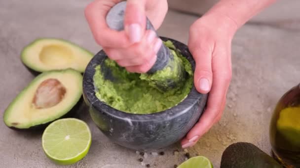 Making Guacamole Sauce Woman Mashing Avocado Marble Mortar Pestle Domestic — ストック動画