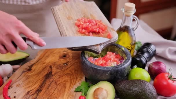 Making Guacamole Sauce Woman Pouring Chopped Onion Bowl Mashed Avocado — Stockvideo