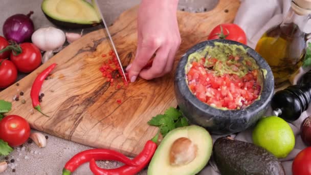 Making Guacamole Sauce Woman Slicing Chili Pepper Wooden Cutting Board — Stockvideo