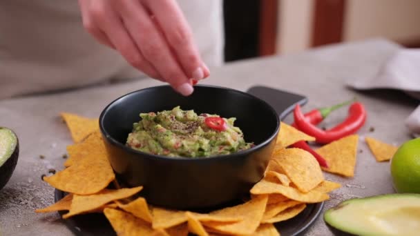 Woman Adding Pepper Spices Freshly Made Guacamole Dip Sauce Marble — Stockvideo