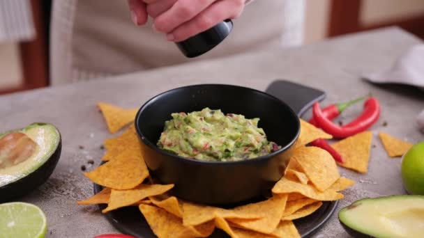 Woman Adding Pepper Spices Freshly Made Guacamole Dip Sauce Marble — Stockvideo
