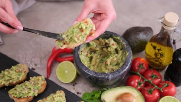 Woman Making Bruschetta Freshly Made Guacamole Sauce Domestic Kitchen — Stockvideo