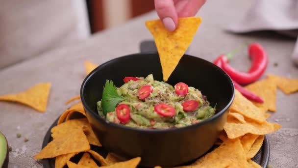 Woman Dips Nachos Chips Freshly Made Guacamole Dip Sauce Marble — Wideo stockowe