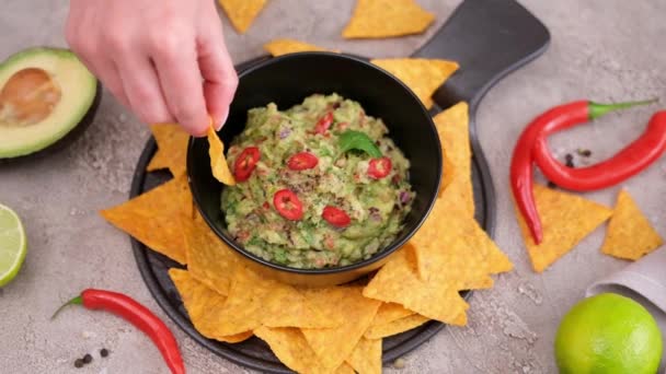 Woman Dips Nachos Chips Freshly Made Guacamole Dip Sauce Marble — Wideo stockowe