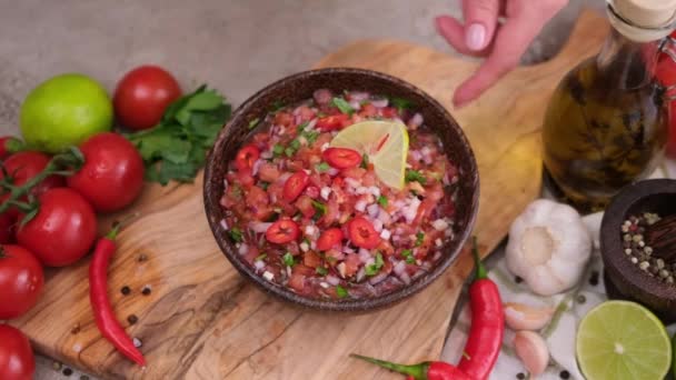 Woman Puts Nacho Chip Salsa Dip Sauce Wooden Bowl — Video Stock