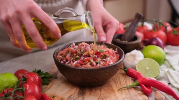 Woman Pours Olive Oil Salsa Dip Sauce Wooden Bowl Domestic — Vídeo de Stock