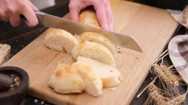 Woman Slicing Fresh Baguette Bread Wooden Cutting Board — 图库视频影像