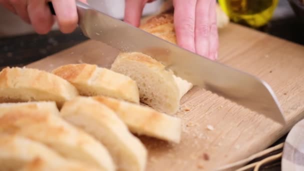 Woman Slicing Fresh Baguette Bread Wooden Cutting Board — 图库视频影像