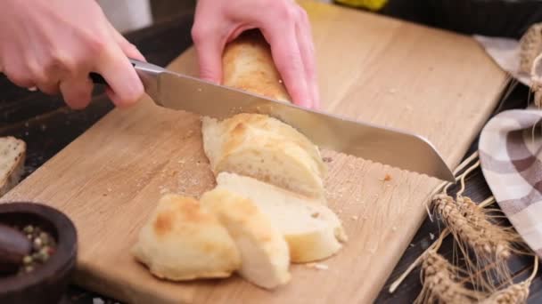 Woman Slicing Fresh Baguette Bread Wooden Cutting Board — Stockvideo