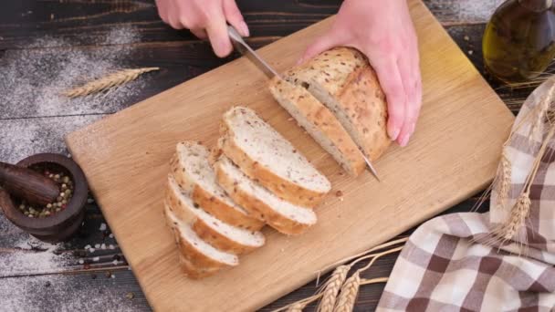 Woman Slicing Bread Wooden Cutting Board — Stockvideo