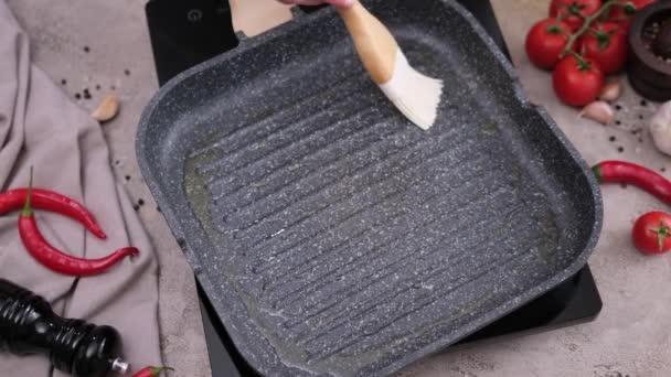 Woman Spreading Cooking Olive Oil Frying Pan Brush — Vídeo de Stock