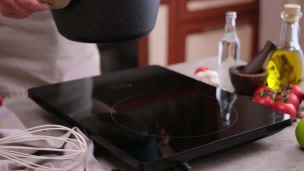 Woman Puts Pot Induction Hob Boiling — Stok video