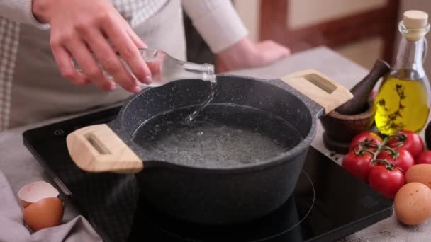 Woman Adding Vinegar Boiling Water Pot Induction Hob Domestic Kitchen — Stok video